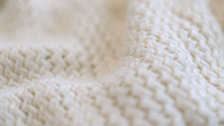 closeup the motion footage vide. Textile abstract background. Clothing industry concept. Wavy clean material. Fibers of knitted clothes with white threads. Knitted fabric threads macro.の写真素材