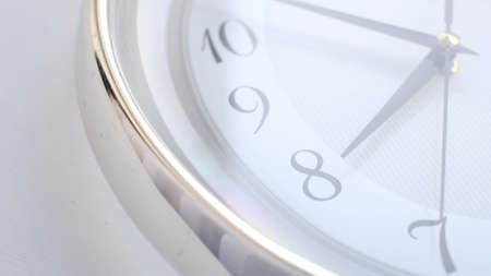 White clock face ticking. Close-up soft focus.の写真素材