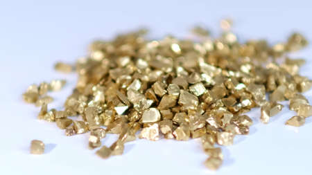 mound of gold. Gold nuggets isolated on white background.の写真素材