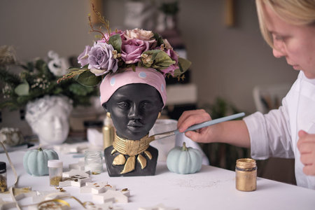 African American Woman bust. pots for flowers in the form of a womans head. soft focusの写真素材