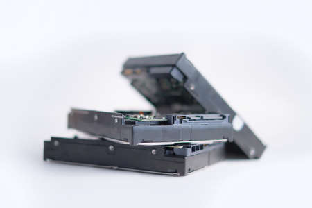 Stack of Hard Disk Drives. Pile of assembled hard drives. Isolated on white. soft focusの写真素材