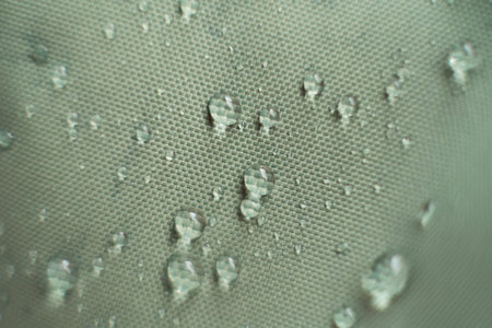 waterproof fabric with waterdrops. non woven fabric water texture background Water drops on...