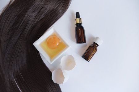 female hair isolated on white background. hair restoration and treatment after winter. Top view,...