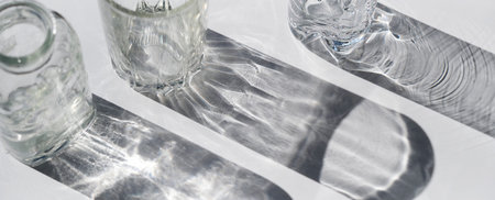 Trendy pattern made with glasses and shadows. glass with sparkling sunlight shadow on the neutral...
