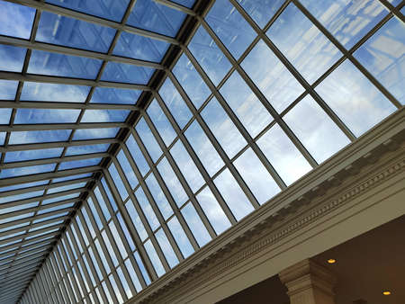 Skylight or glass sunroof ceiling of a building. Window in commercial office or industrial building. Modern design architecture, or energy conservation model using nature sunlight conceptの写真素材