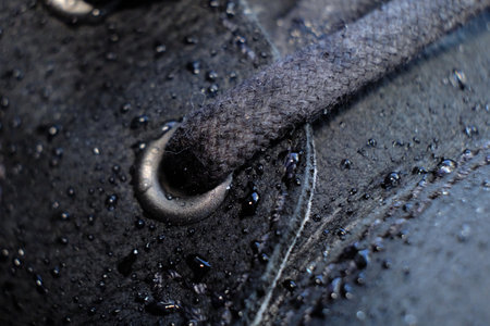 close-up details waterproof mens black boots. Drops of rain on suede shoes.の写真素材