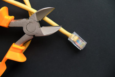 internet or telephone line cables and crimper. Concept of network troubleshoot supporter or...