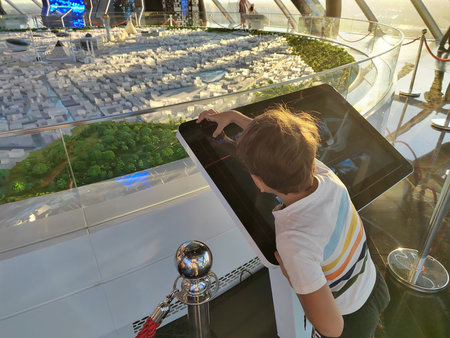 Young boy looking at a science exhibit, close up. childrens education in the museum using the touch...