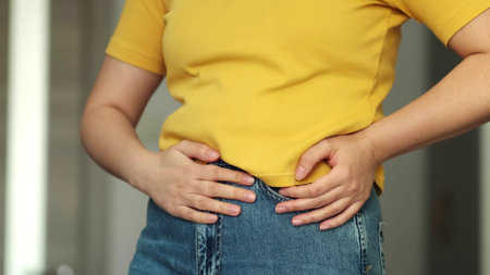 Stomach pain and others stomach disease concept.Girl having a stomachache. Woman Stomach Ache.の写真素材