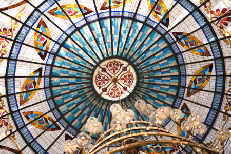 part of a Gothic-style stained glass ceiling, made of colored glass. The shapes and colors are just stunning, and the sunlight creates such a playful play of light and shadow.の写真素材