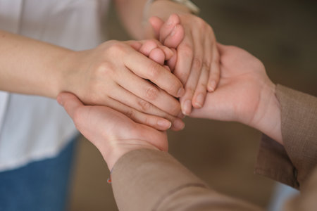 woman holding another in a comforting embrace, mental health awareness and the importance of supporting each other through difficult times. Mental health awareness campaigns.の写真素材