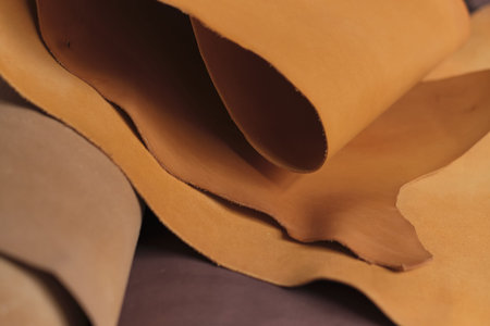 arrangement of premium beige leather, exhibiting the beauty and diversity of natural materials. The...