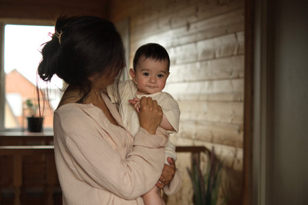 Family Foundations: Witness a mothers pure joy as she snuggles her one-year-old, framed by the...