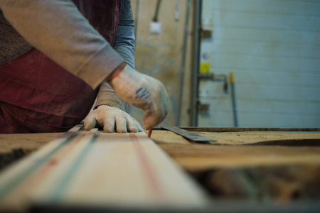 Measurement for cutting on raw wood, care taken. This ties to the artisanal trend of personalized home decor.の写真素材