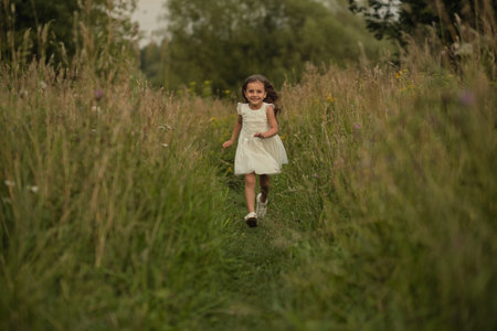 The youngsters animated trot in the open air speaks to a world of imagination. The scene is an ideal representation for the push towards eco-friendly living and sustainable practices.の写真素材