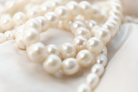The soft focus pearls on a white canvas evoke a sense of calm and timeless beauty. This tranquil...