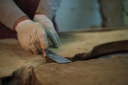 Measurement for cutting on raw wood, care taken. This ties to the artisanal trend of personalized...