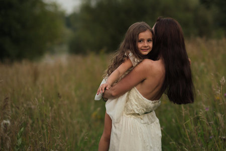In natures embrace, a girl finds comfort with her mother. As mental health issues rise, natures therapy becomes evident.の写真素材