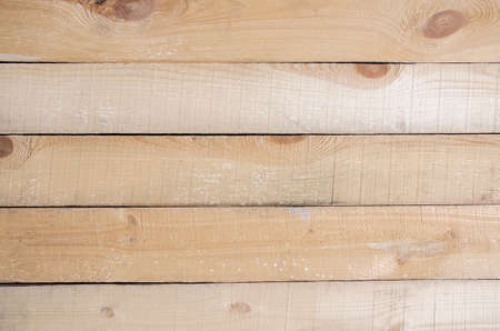 Raw, unpainted boards of light tone. Wooden table, laminate. Wooden background shot from above.の写真素材
