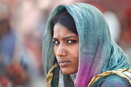 VARANASI, INDIA - 22/03/2013 : Unidentified young indian woman with her colorful scarf.Scarf made of indian silk is very common and popular among Indian woman,.のeditorial素材