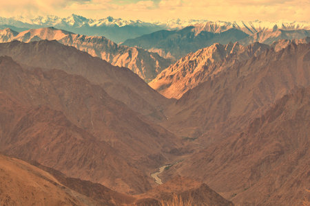 wide angle view of a rocky mountains and valley in ladakh