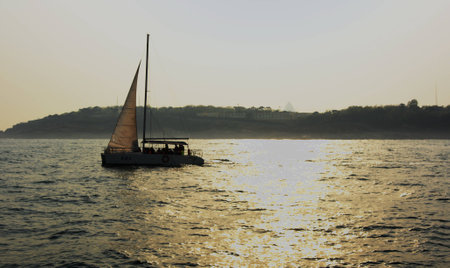 Sail boat in the sea during sunsetの写真素材