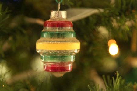 Retro glass Christmas ornament on the tree, shallow DOF.の写真素材