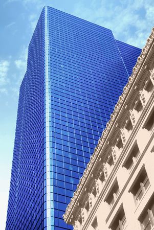 New skyscraper and old building in Boston, MA, USA. Newsprint treatment on old building.の写真素材