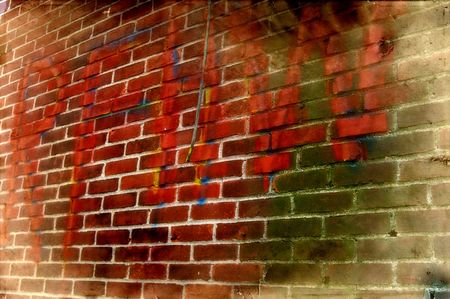 Brick wall with graffiti and grunge elements.の写真素材