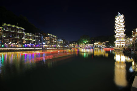 The nightscape of the Tuojiang River in Phoenix Townの写真素材