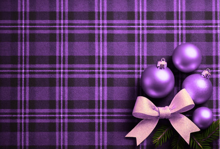 Purple christmas balls on plaid background with copy space.の素材