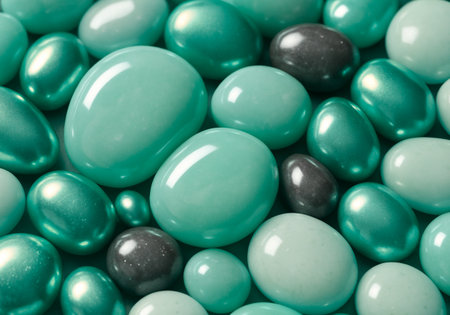 Green and black candies as background, closeup. Toned.の素材