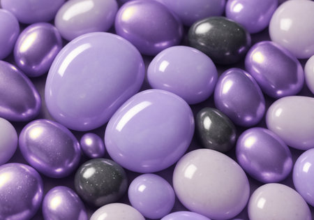 Purple and black candies background. Top view. Close up.の素材