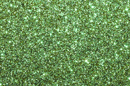 green glitter texture christmas abstract background, shiny sequins. defocusedのeditorial素材