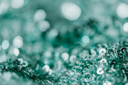 green glitter christmas abstract background with bokeh defocused lightsのeditorial素材