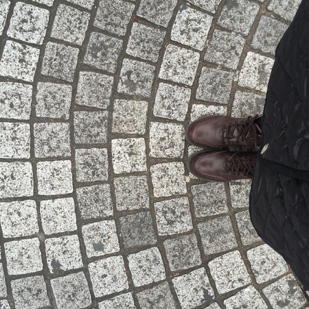 Legs and shoes. Conceptual image of legs in boots. Feet shoes walking in natureの素材
