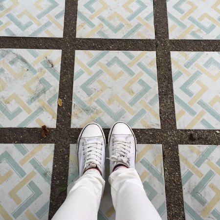 White Sneakers shoes walking on groundの素材
