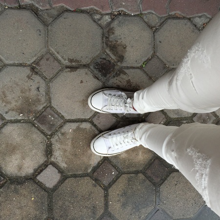 White Sneakers shoes walking on groundの素材