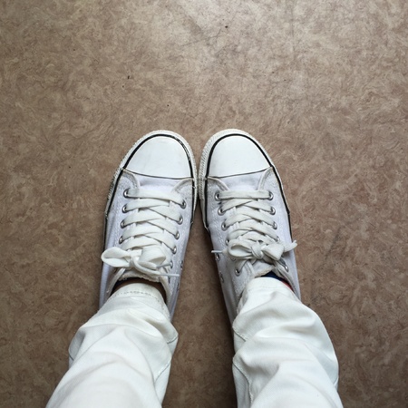 White Sneakers shoes walking on groundの素材