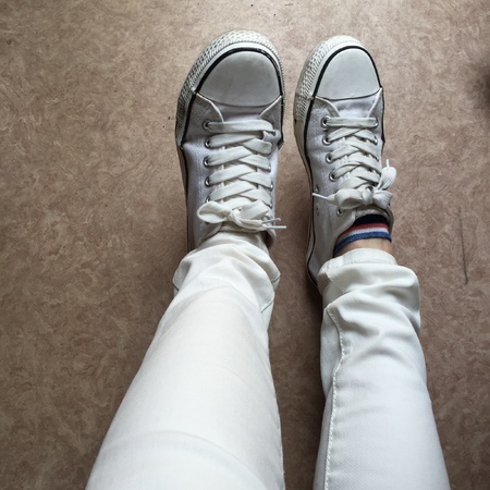 White Sneakers shoes walking on groundの素材