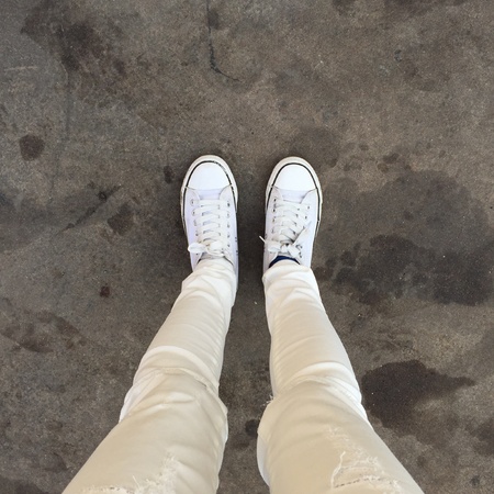 White Sneakers shoes walking on groundの素材