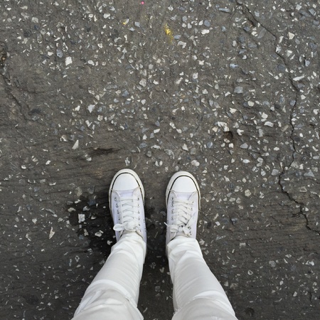 White Sneakers shoes walking on groundの素材