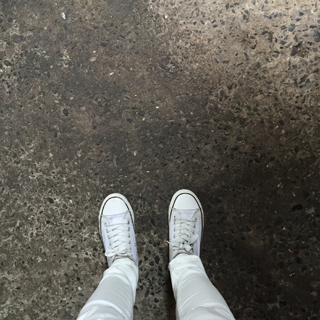 White Sneakers shoes walking on groundの素材