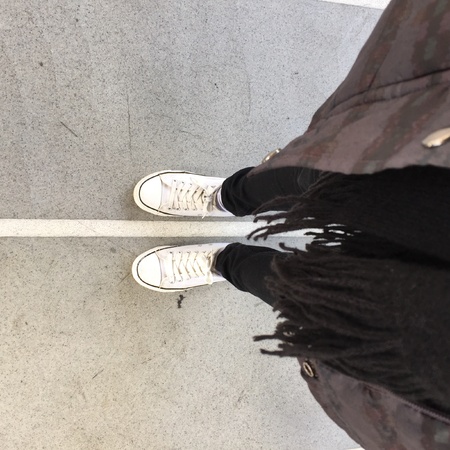 White Sneakers shoes walking on groundの素材