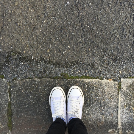 White Sneakers shoes walking on groundの素材