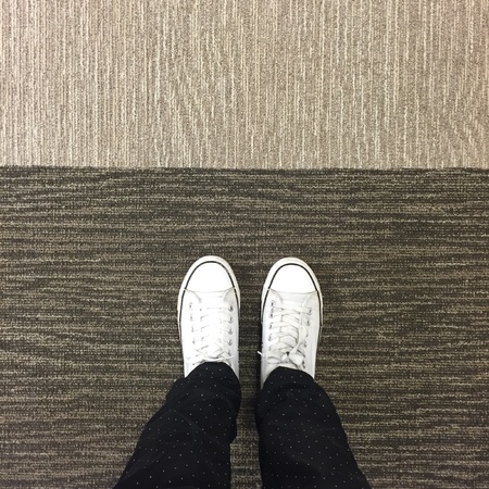 White Sneakers shoes walking on groundの素材