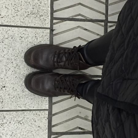 Legs and shoes. Conceptual image of legs in boots. Feet shoes walking in natureの素材