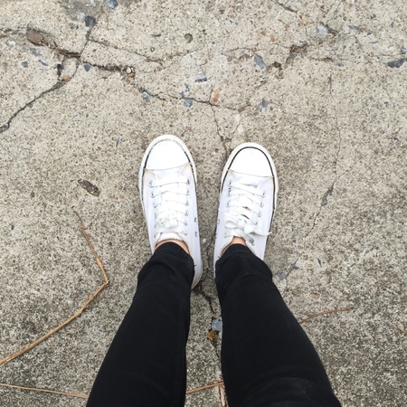 White sneakers on girl legs on the background great for any use.の写真素材
