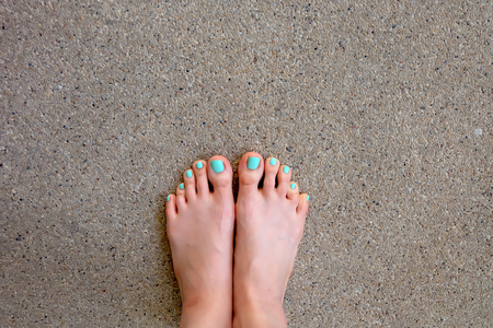 Beautiful female legs and feet on floor background Great For Any Use.の写真素材