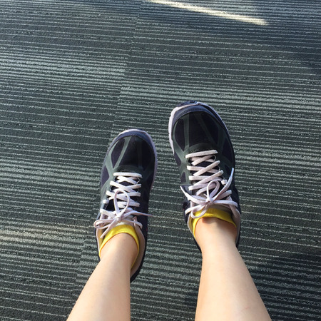 Female Runner Running on Carpet Background, Closeup on Shoes Great For Any Use.の写真素材